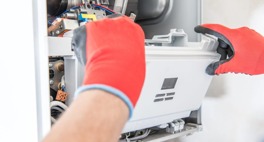 Technician Repairing Furnace