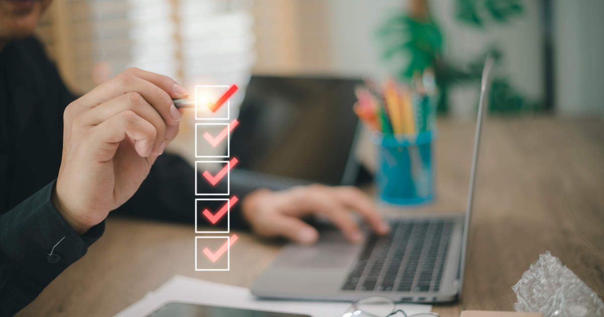 floating checklist in front of laptop